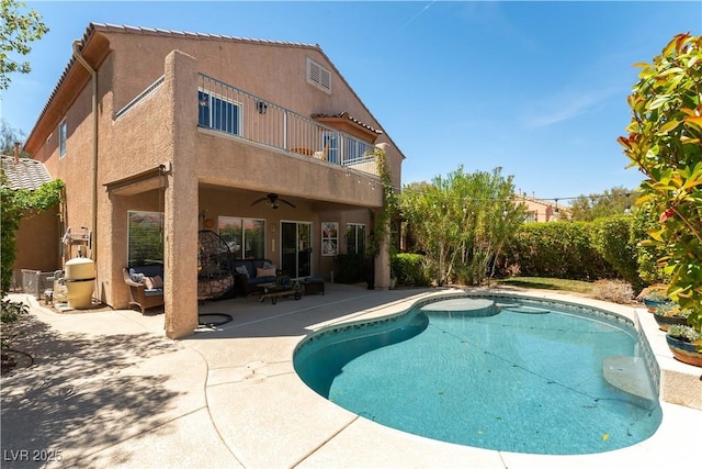 view of swimming pool with ceiling fan, an outdoor living space, a patio area, and a fenced in pool