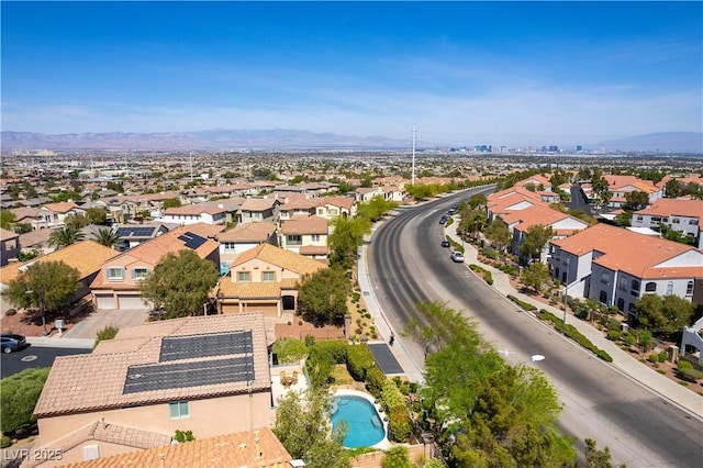 birds eye view of property featuring a mountain view and a residential view