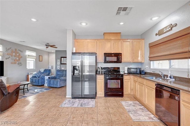 722 Chepstow Ave, Las Vegas, NV 89178 - kitchen with open floor plan, a sink, black appliances, and light brown cabinets
