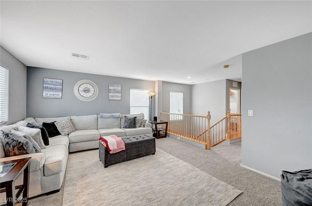 722 Chepstow Ave, Las Vegas, NV 89178 - living room featuring carpet flooring, baseboards, and visible vents