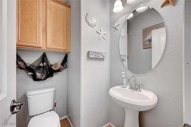 722 Chepstow Ave, Las Vegas, NV 89178 - half bathroom featuring a sink and toilet