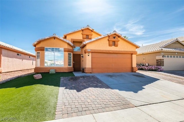 view of front of house with a garage, stucco siding, concrete driveway, and a front lawn