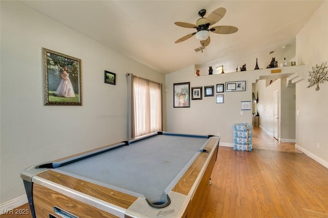 game room featuring a ceiling fan, pool table, baseboards, light wood-type flooring, and vaulted ceiling