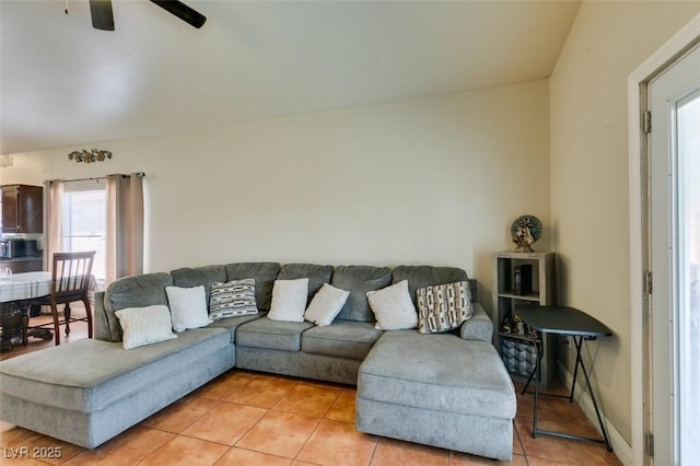 living room featuring ceiling fan and light tile patterned flooring