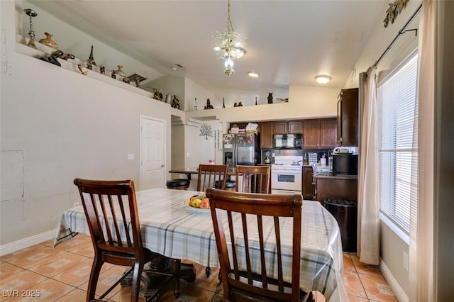 dining room with baseboards, a notable chandelier, vaulted ceiling, and light tile patterned floors