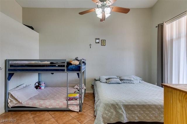 bedroom featuring tile patterned flooring and ceiling fan
