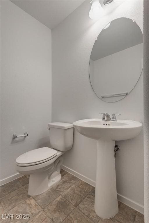 345 Gracious Way, Henderson, NV 89011 - half bath with toilet, baseboards, and a sink