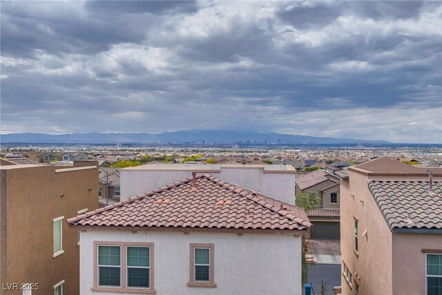 345 Gracious Way, Henderson, NV 89011 - view of home's exterior with stucco siding, a tile roof, a mountain view, and a residential view