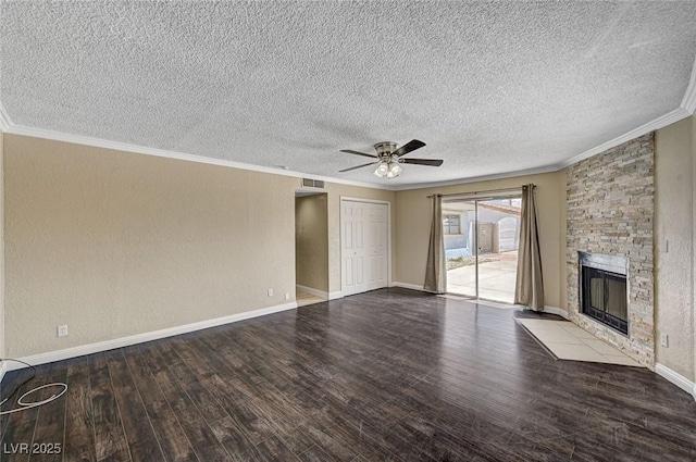 unfurnished living room with crown molding, ceiling fan, wood finished floors, and a fireplace
