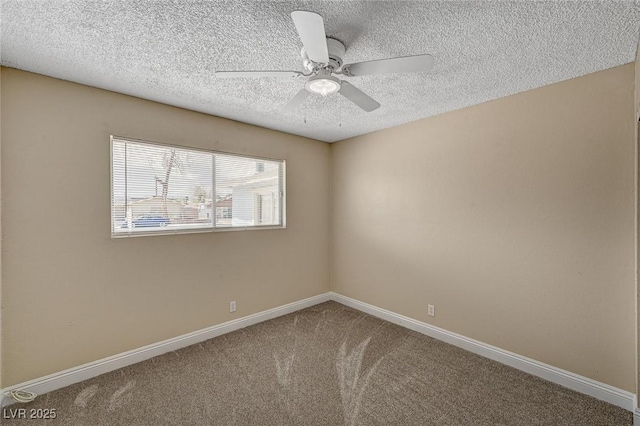 carpeted spare room featuring baseboards, ceiling fan, and a textured ceiling