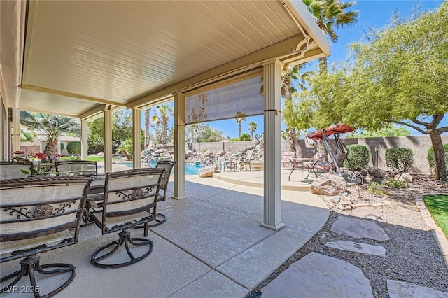 view of patio featuring a fenced in pool and fence