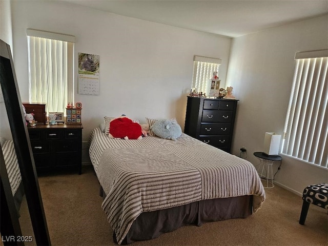 bedroom with carpet flooring and baseboards