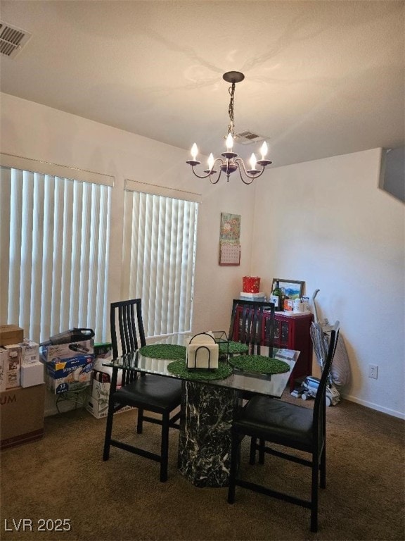carpeted dining room with visible vents and a notable chandelier
