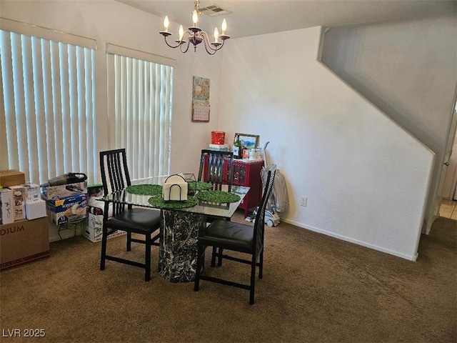 dining room with carpet flooring, a notable chandelier, visible vents, and baseboards
