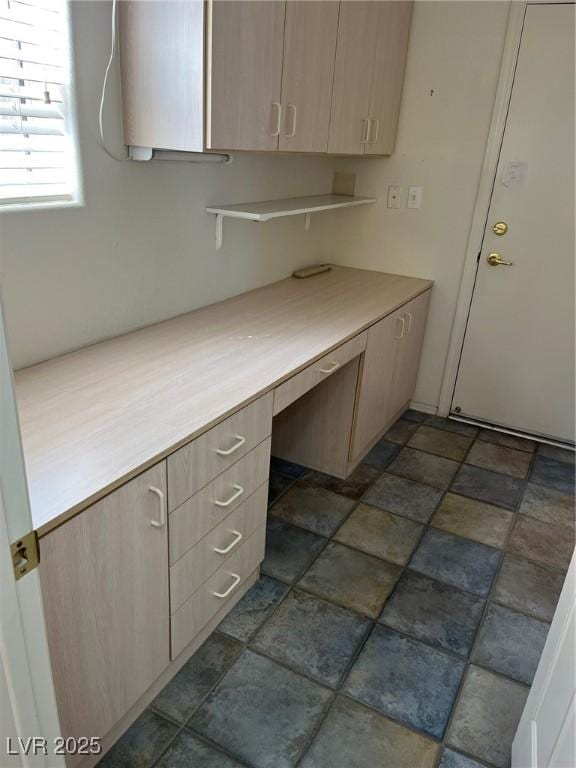 10717 Grand Cypress Ave, Las Vegas, NV 89134 - kitchen with light countertops, light brown cabinets, and built in desk