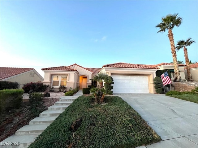 10717 Grand Cypress Ave, Las Vegas, NV 89134 - mediterranean / spanish-style home with a garage, a tiled roof, concrete driveway, and stucco siding