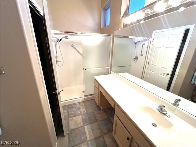 10717 Grand Cypress Ave, Las Vegas, NV 89134 - bathroom with stone finish flooring, a shower stall, and vanity