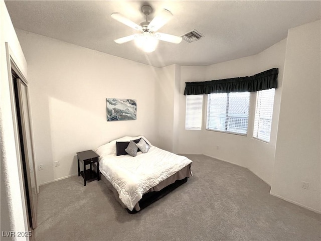 10717 Grand Cypress Ave, Las Vegas, NV 89134 - carpeted bedroom with ceiling fan and visible vents