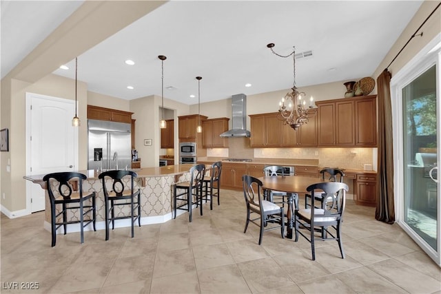 dining area featuring plenty of natural light, light tile patterned flooring, and a notable chandelier