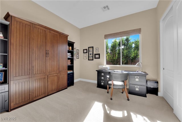 office area with light colored carpet, baseboards, and visible vents
