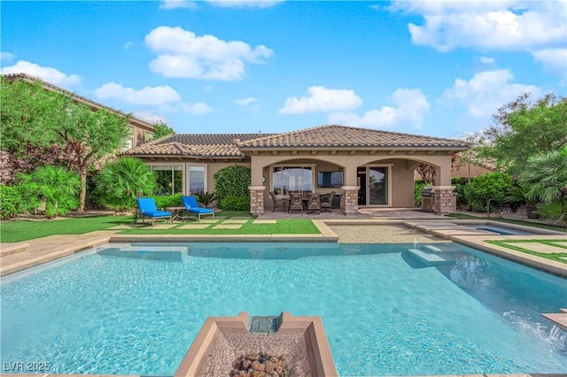 back of property with a hot tub, an outdoor pool, a tile roof, and stucco siding