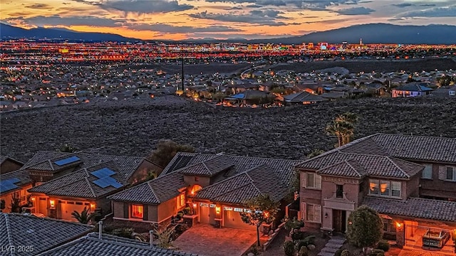 aerial view at dusk with a residential view and a mountain view
