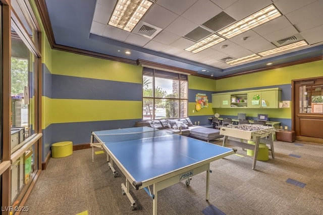playroom featuring visible vents, carpet, a tray ceiling, and a healthy amount of sunlight