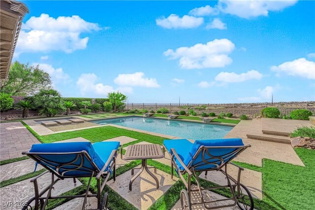 view of pool featuring a fenced in pool, a fenced backyard, and a patio area