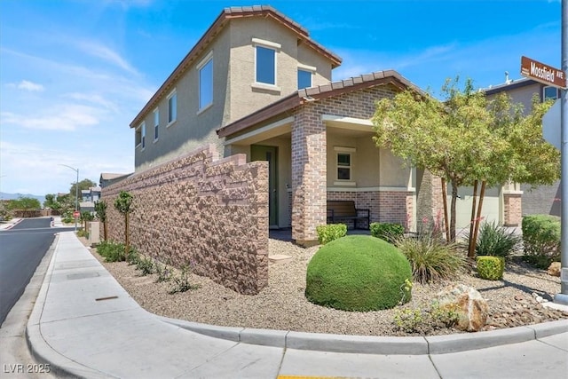 3136 Mossfield Ave, Henderson, NV 89052 - view of property exterior with stucco siding and brick siding