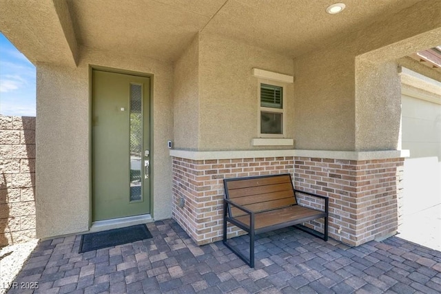 3136 Mossfield Ave, Henderson, NV 89052 - doorway to property featuring stucco siding and brick siding