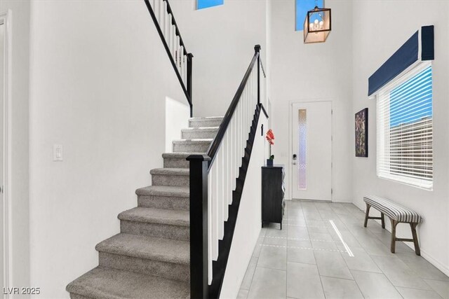 3136 Mossfield Ave, Henderson, NV 89052 - stairs featuring a towering ceiling and tile patterned floors