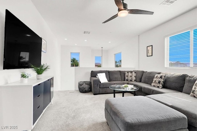 3136 Mossfield Ave, Henderson, NV 89052 - living room featuring light colored carpet, plenty of natural light, ceiling fan, and recessed lighting