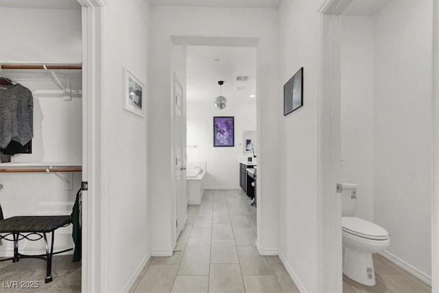 3136 Mossfield Ave, Henderson, NV 89052 - bathroom featuring vanity, tile patterned floors, a spacious closet, and a tub
