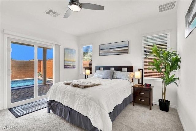3136 Mossfield Ave, Henderson, NV 89052 - bedroom with light colored carpet, access to exterior, and ceiling fan