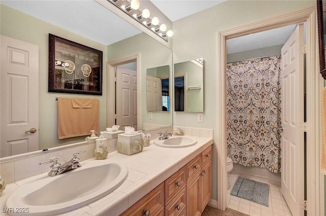 bathroom with double vanity, a sink, toilet, and a shower with curtain