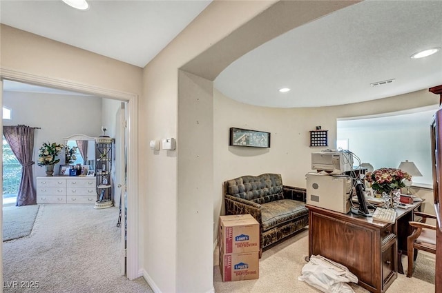 office area featuring carpet, recessed lighting, and visible vents