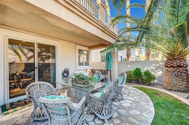 view of patio / terrace featuring fence and outdoor dining space