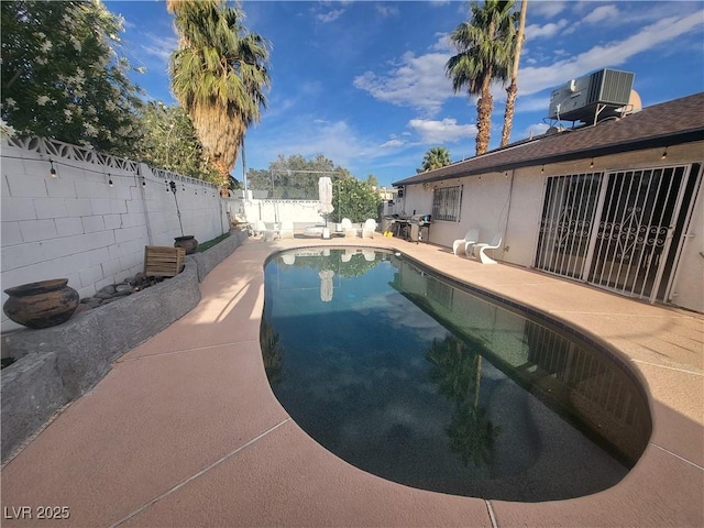 3164 Elmrock Pl, Las Vegas, NV 89121 - view of swimming pool featuring a patio, a fenced in pool, a fenced backyard, and cooling unit