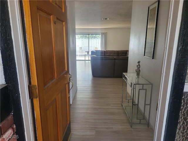 3164 Elmrock Pl, Las Vegas, NV 89121 - corridor featuring light wood-style floors