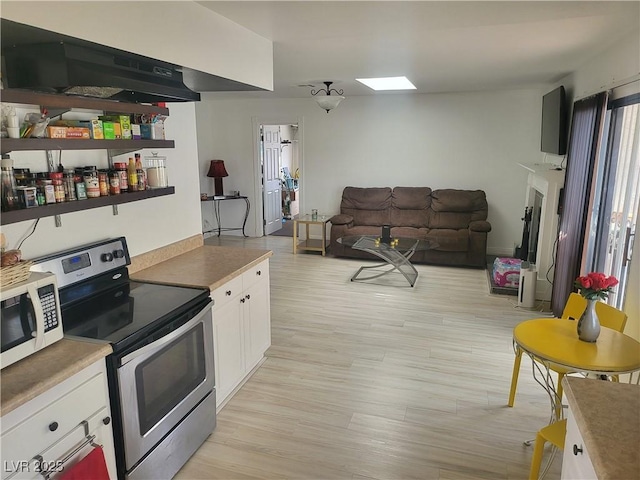 3164 Elmrock Pl, Las Vegas, NV 89121 - kitchen featuring white cabinets, electric range, light wood-style flooring, open floor plan, and white microwave