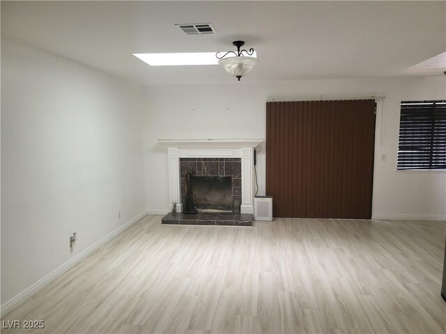 3164 Elmrock Pl, Las Vegas, NV 89121 - unfurnished living room featuring wood finished floors and a fireplace