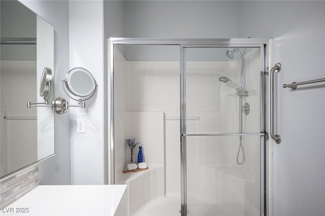 full bath featuring a shower stall