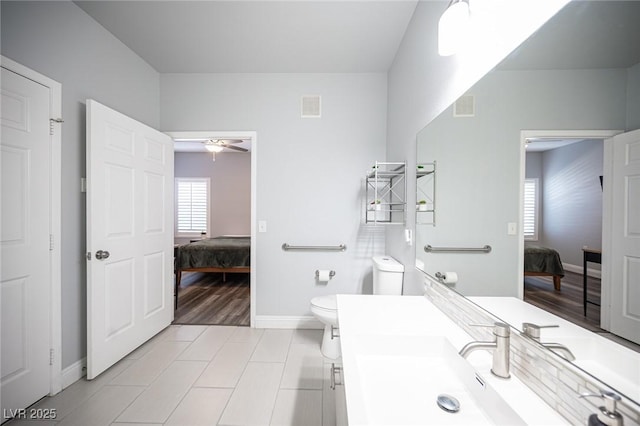 bathroom featuring a ceiling fan, ensuite bath, and visible vents