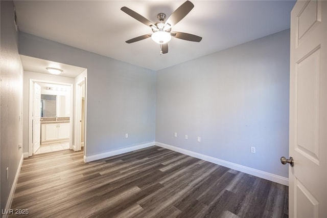 unfurnished bedroom with baseboards, ceiling fan, and dark wood-style floors