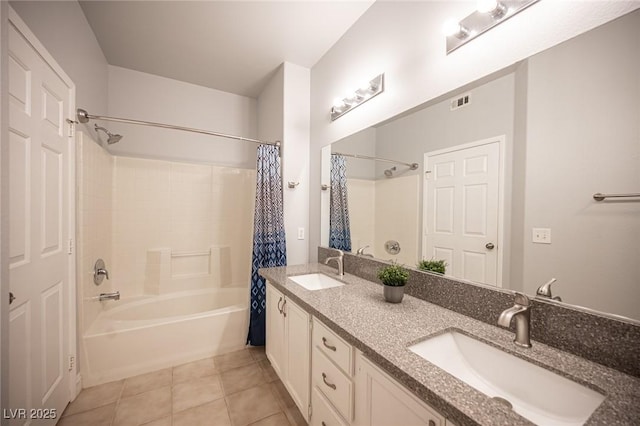 bathroom with double vanity, tile patterned floors, shower / bath combination with curtain, and a sink