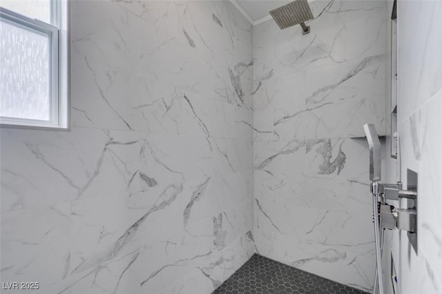 full bath featuring a wealth of natural light and a marble finish shower