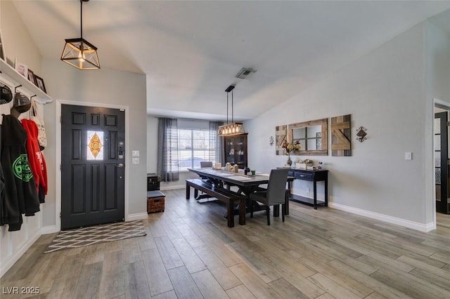 dining space featuring visible vents, baseboards, and light wood-type flooring