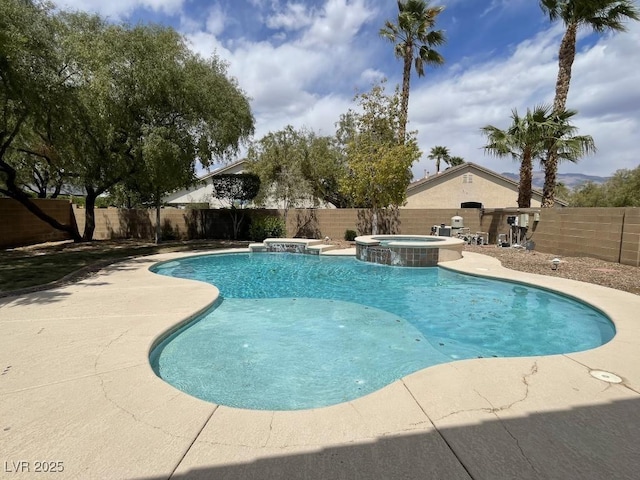 view of swimming pool featuring a fenced backyard, a patio, and a pool with connected hot tub