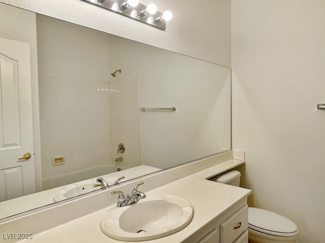 full bathroom featuring vanity, bathtub / shower combination, and toilet