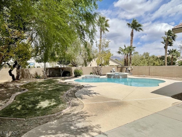 view of swimming pool featuring a fenced backyard, a patio, and a pool with connected hot tub